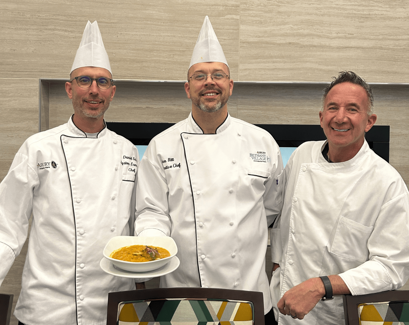 Executive Chef Jon Ritt (center) with his interpretation of “Mulligatawny Soup”. 